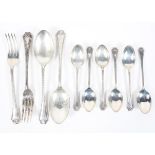 An assortment of silver flatware including spoons,