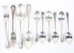 An assortment of silver flatware including spoons,