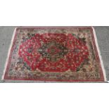 A 20th century wool rug woven in the Persian style,