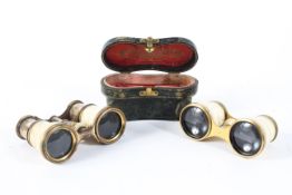 Two pairs of 19th century ivory opera glasses and a leather case, the first inscribed for G&C Dixey,