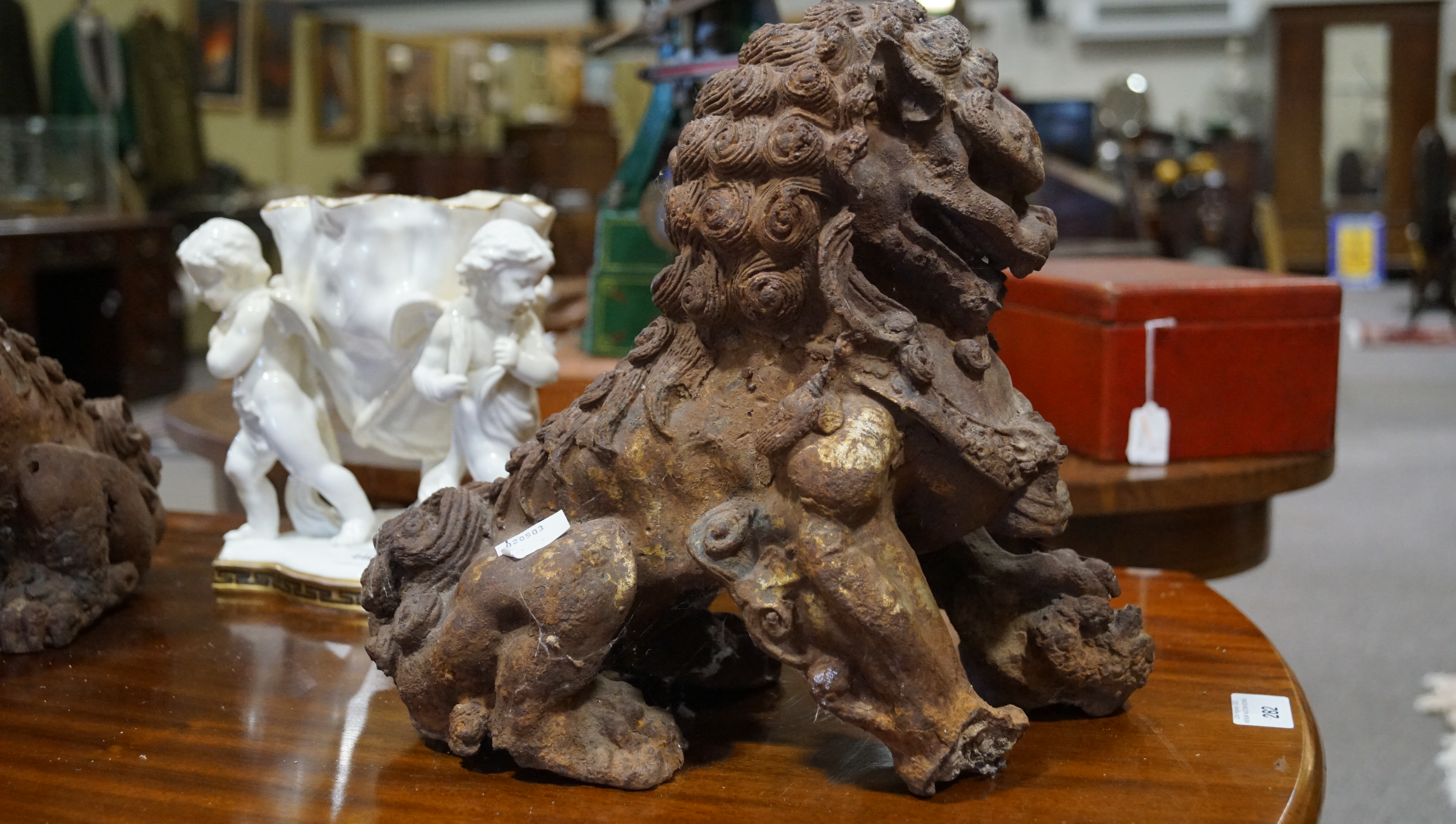 A pair of Chinese cast iron lions, each modelled seated with front paw on a brocaded ball, - Image 6 of 15