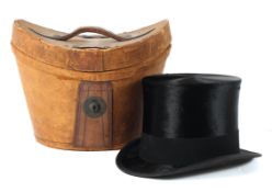 A Woodrow (London) moleskin and silk top hat in a leather box, early 20th century,