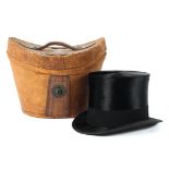 A Woodrow (London) moleskin and silk top hat in a leather box, early 20th century,