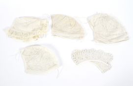 Four lace Victorian baby's bonnets and a pair of lappets,