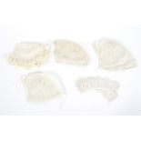 Four lace Victorian baby's bonnets and a pair of lappets,