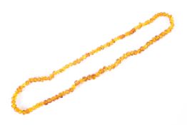 An Amber beaded necklace, 33cm drop,