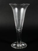 A Georgian oversized wine goblet, with trumpet-shaped bowl on clear stem with tear inclusion,