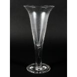 A Georgian oversized wine goblet, with trumpet-shaped bowl on clear stem with tear inclusion,