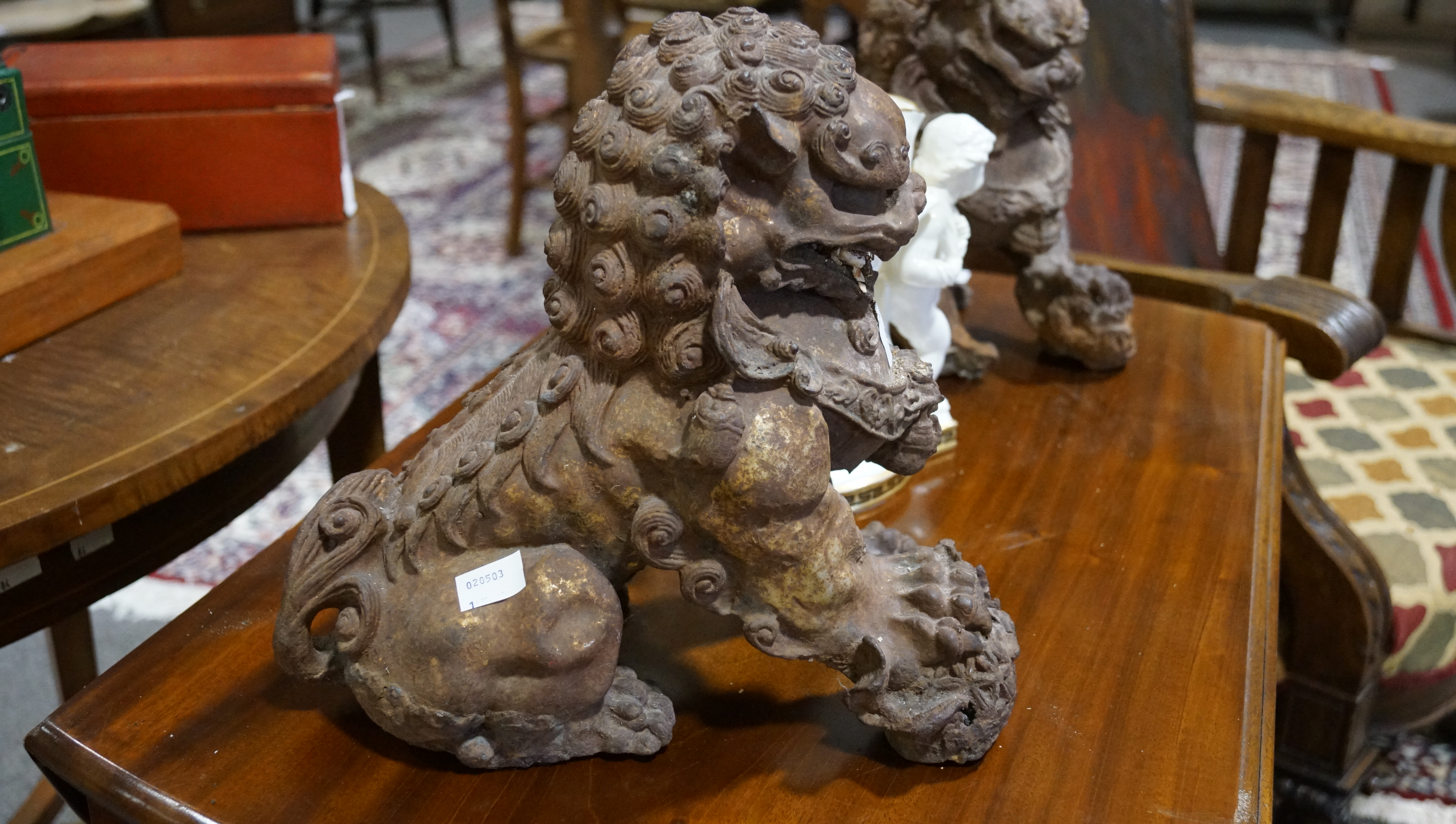 A pair of Chinese cast iron lions, each modelled seated with front paw on a brocaded ball, - Image 11 of 15
