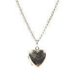 A 9ct gold chain with a heart shaped locket,