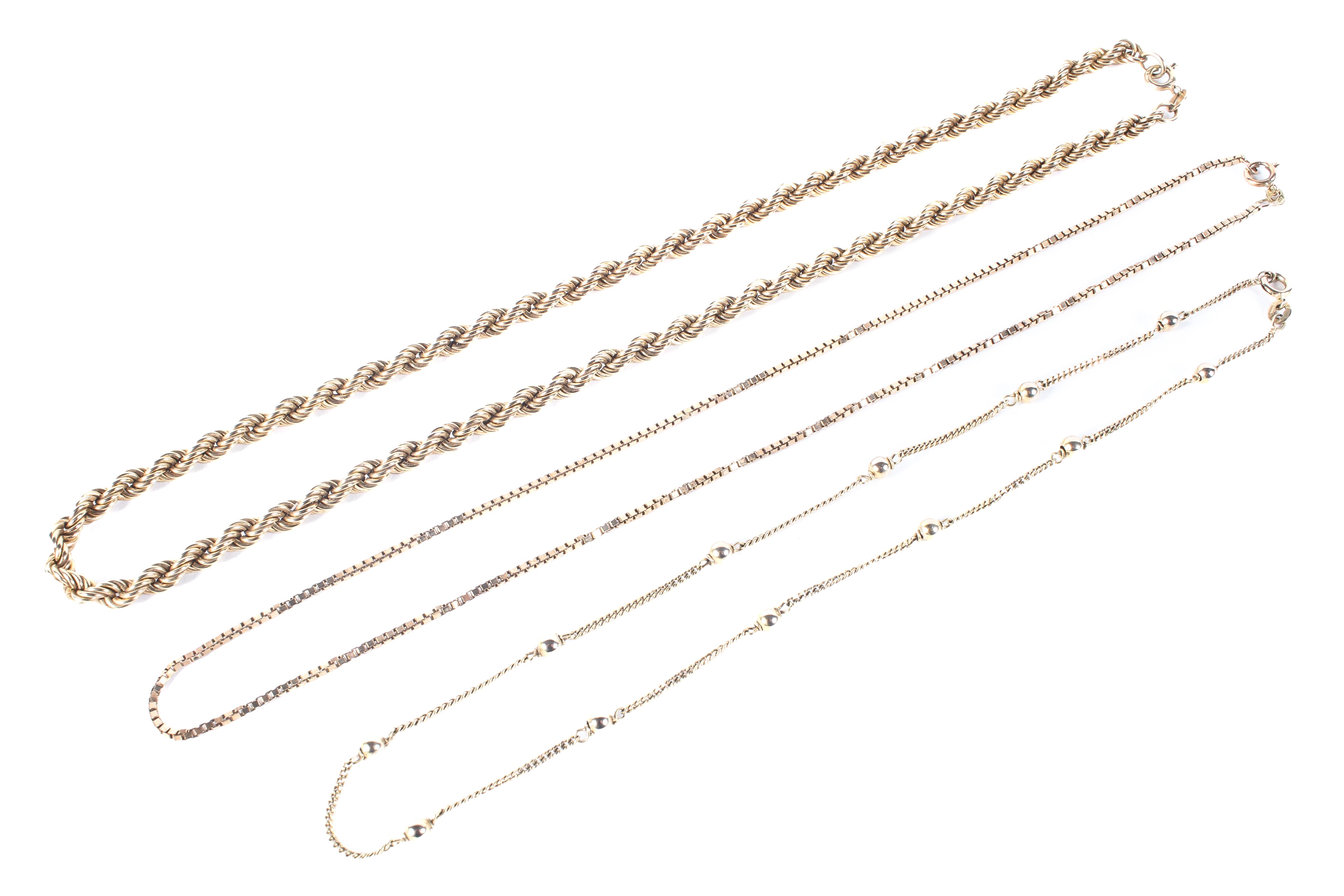 Three assorted 9ct gold necklaces,
