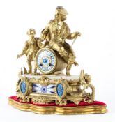 A French gilt metal and porcelain mounted eight day striking mantel clock,
