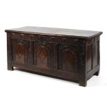 An 18th century oak and marquetry inlaid coffer,