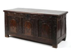 An 18th century oak and marquetry inlaid coffer,