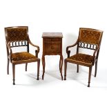 A pair of Edwardian mahogany inlaid arm chairs together with a French marble topped bedside table,