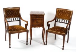 A pair of Edwardian mahogany inlaid arm chairs together with a French marble topped bedside table,