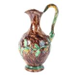 A late 19th century Portuguese Paliisy Ware ewer, with branch moulded handle,