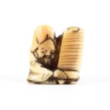 A small Japanese Meiji period marine ivory netsuke of Fukurokuju seated in a patterned robe