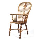 A 19th century ash and elm windsor armchair, with shaped pierced splat and spindles,