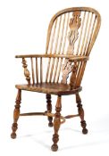 A 19th century ash and elm windsor armchair, with shaped pierced splat and spindles,