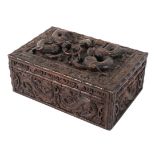 A Chinese carved wooden box, late 19th - early 20th century, carved with dragons and C-scrolls,