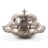 A silver lidded muffin dish with leaf finial, decorated with swags and foliage raised on bun feet,