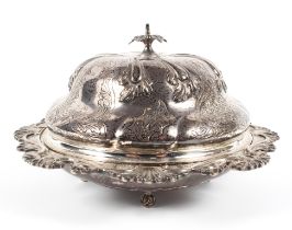 A silver lidded muffin dish with leaf finial, decorated with swags and foliage raised on bun feet,