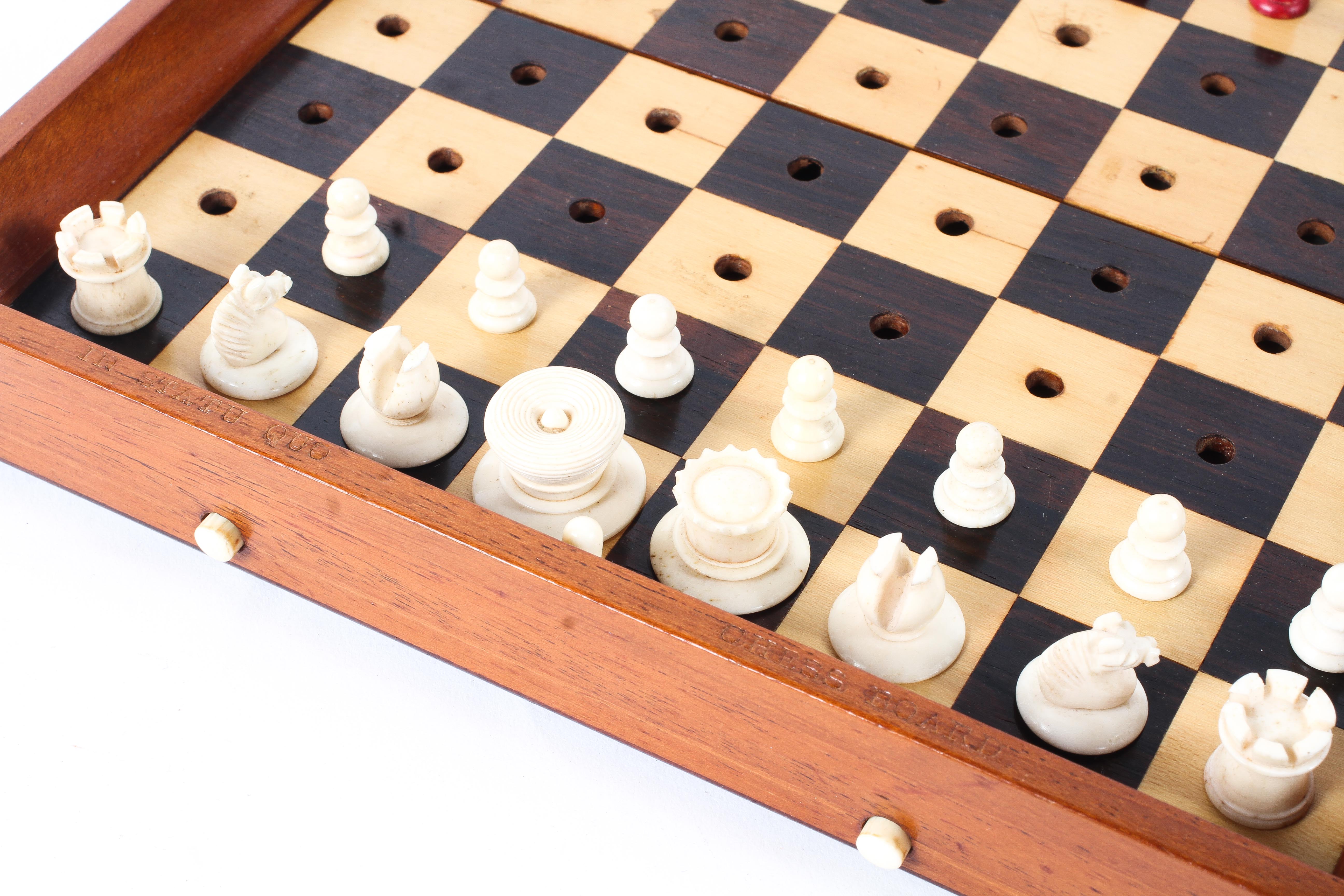 A Jacques & Son (London) travelling chess set in box, with folding mahogany chess board, - Image 2 of 16