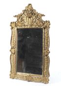 A 19th century giltwood and gesso mirror frame, of rectangular form,