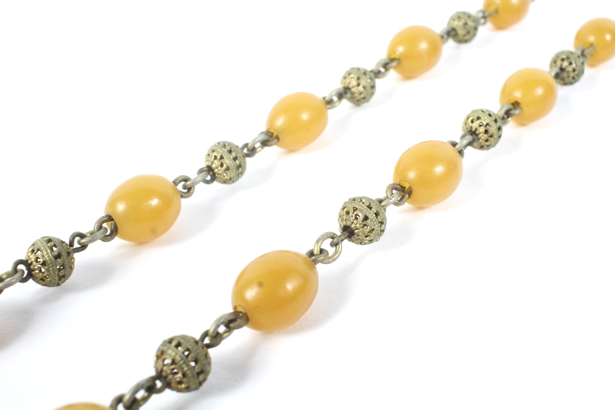 An early 20th century yellow amber necklace of three similar sized beads and fourteen smaller beads - Image 2 of 2