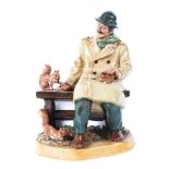 A Royal Doulton figure of a gentleman feeding squirrels on a bench, titled 'Lunchtime',