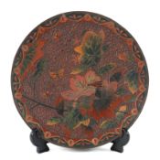 An Asian cloissonne enamel dish, late 19th/early 20th century, decorated in mottled red,