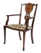 An Edwardian mahogany inlaid armchair,