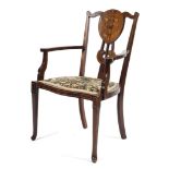 An Edwardian mahogany inlaid armchair,