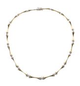 A 9ct yellow and white gold bow tie and bow link style necklace,