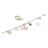 A 9ct gold charm bracelet with an assortment of eight charms, including a miniature dice,