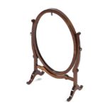 An Edwardian mahogany oval shaped dressing table swing mirror,