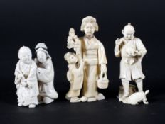 Three late 19th century Japanese carved ivory okimono, comprising a woman holding grapes,