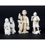 Three late 19th century Japanese carved ivory okimono, comprising a woman holding grapes,