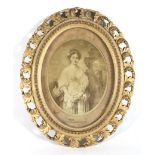 A 19th century giltwood oval picture frame and a sepia print of a portrait of a lady