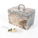 A fine Russian silver tea caddy in the form of a metal trunk with swing carrying handle,