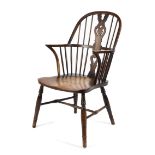 A low hooped elm seated Windsor elbow chair,