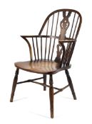 A low hooped elm seated Windsor elbow chair,