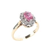 A 9ct gold daisy pink sapphire and diamond dress ring, the central stone surrounded by diamonds,