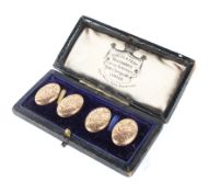 A pair of 9ct gold cufflinks with engraved decoration,
