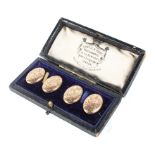 A pair of 9ct gold cufflinks with engraved decoration,