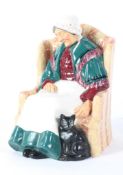 A Royal Doulton figure of an old lady sleeping in a chair, titled 'Forty Winks',