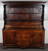 A fine late 18th century closed oak dresser,