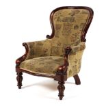 A Victorian mahogany framed spoonback gentleman's elbow chair,