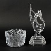 A Kosta Boda moulded glass bowl and an Art Deco style lady, each of clear glass,